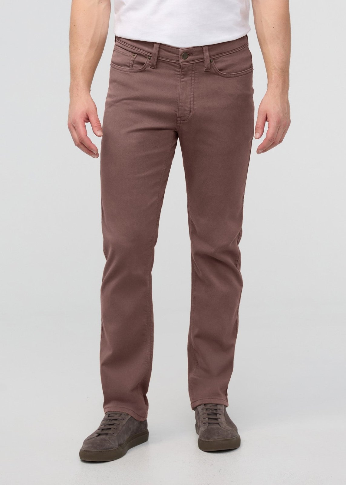 Man wearing white t-shirt and straight-leg brown pants with brown lace-up shoes.