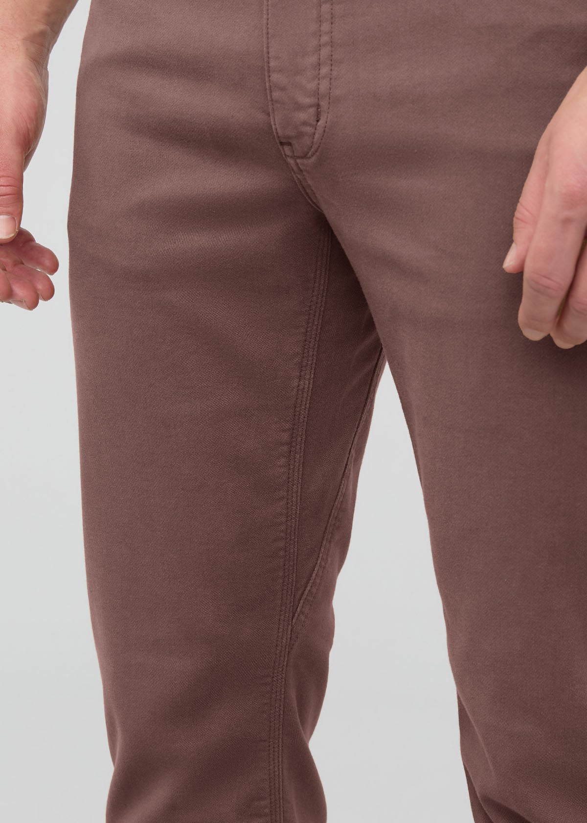 Mauve-brown straight-leg pants with center seam detail, shown on model from waist to knee.