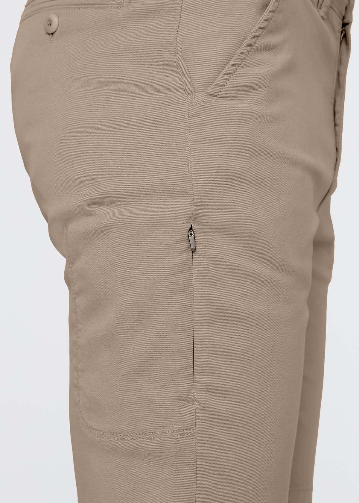 Sandstone-colored shorts with button waistband, side pockets, and ventilation eyelets on thighs.