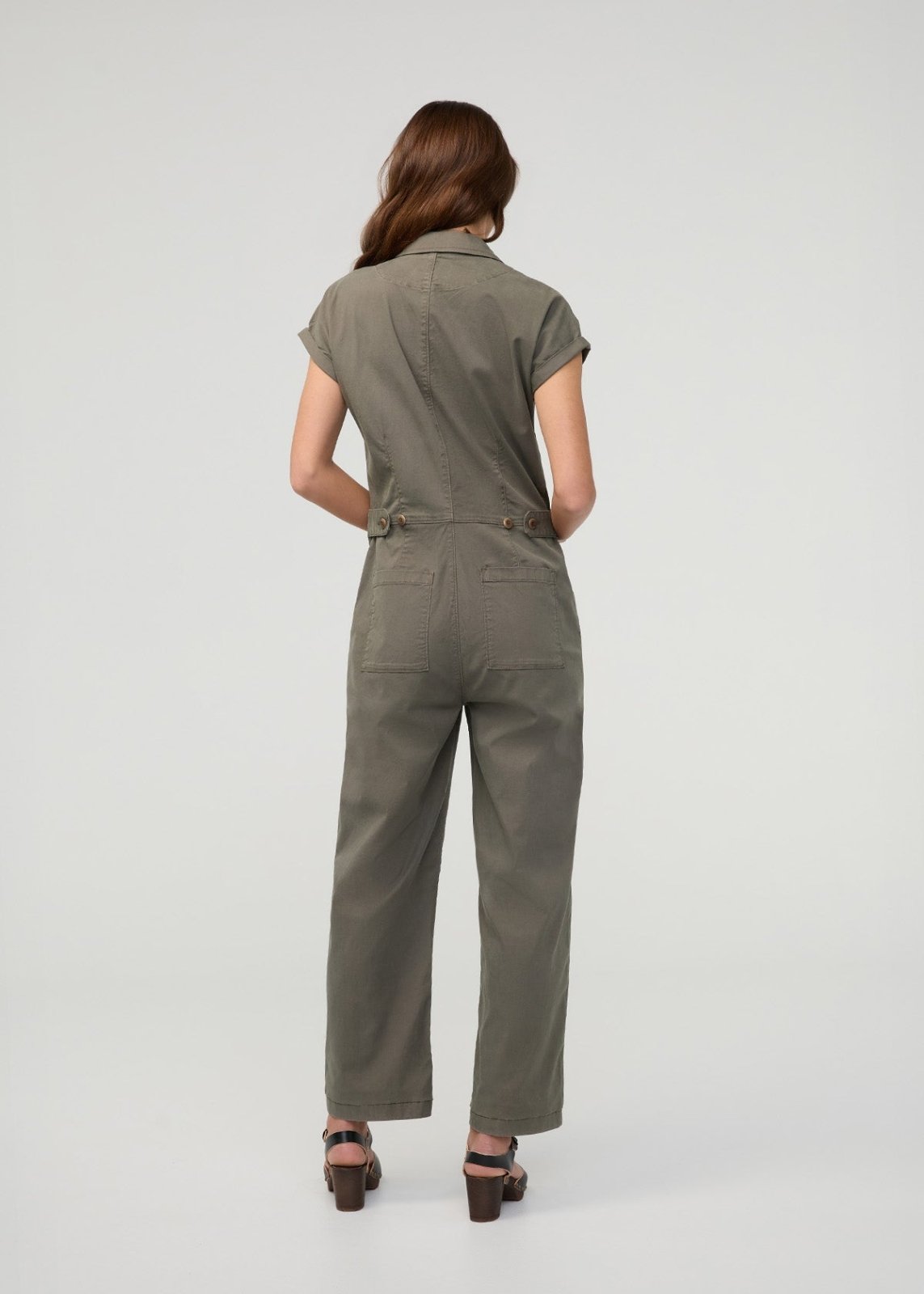 Thyme boiler suit with short sleeves, button front, chest pockets, and wide-leg pants, shown on model from back view.