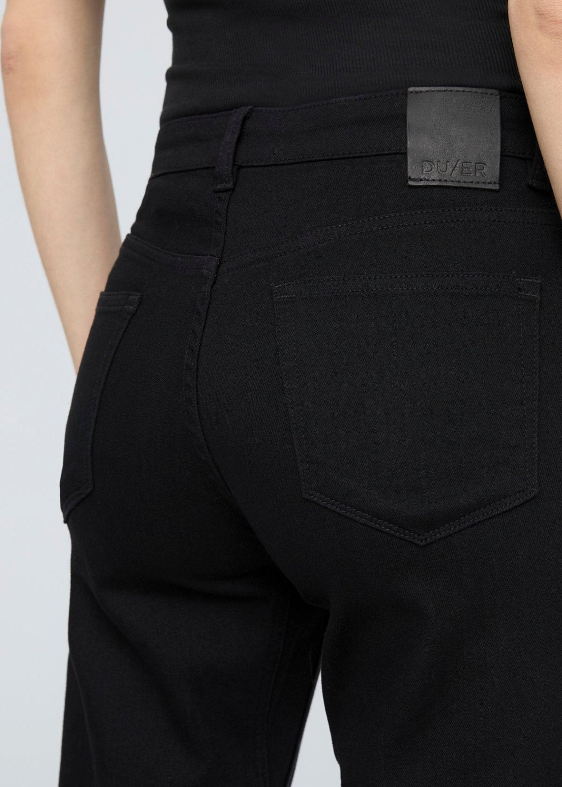 women's black relaxed fit stretch mid rise jeans back waistband detail