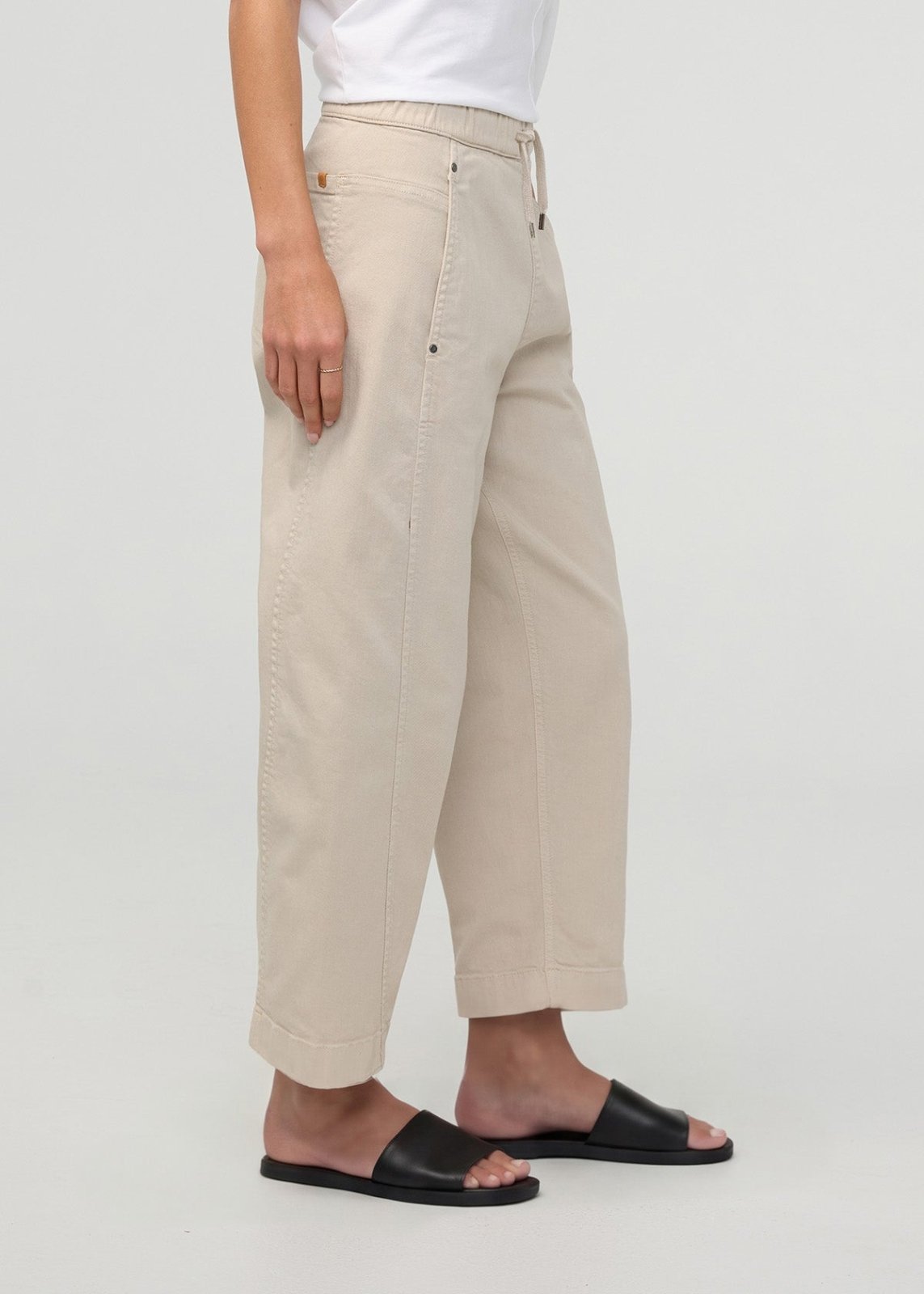 Sandstone pull-on barrel pants with relaxed fit, cropped length, and visible stitching details.