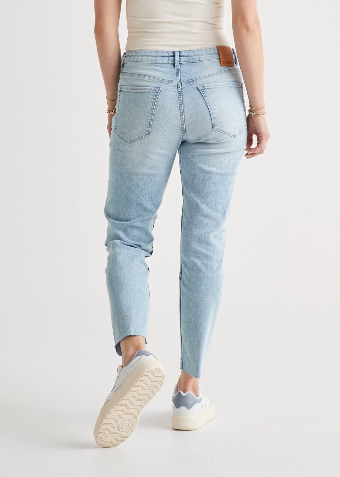 womens coastal blue relaxed fit stretch jeans raw hem detail